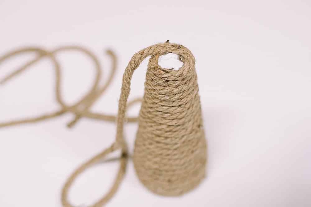 Continue wrapping jute around cone until it covers the whole thing.