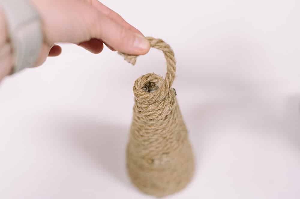 Cut the jute and tuck it down into the hole at the top of the cone, glue.
