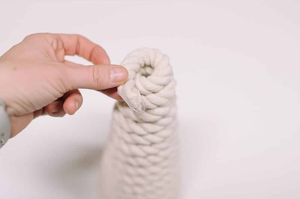 Stick rope down into the hole at the top of the diy Christmas tree.