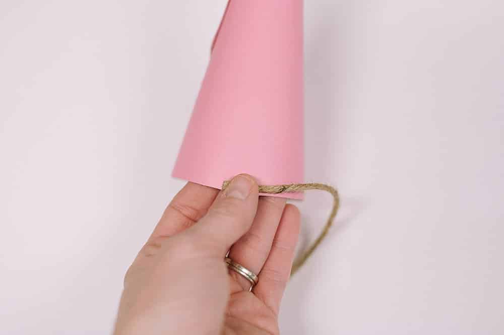 Hot glue twine and wrap around cone.