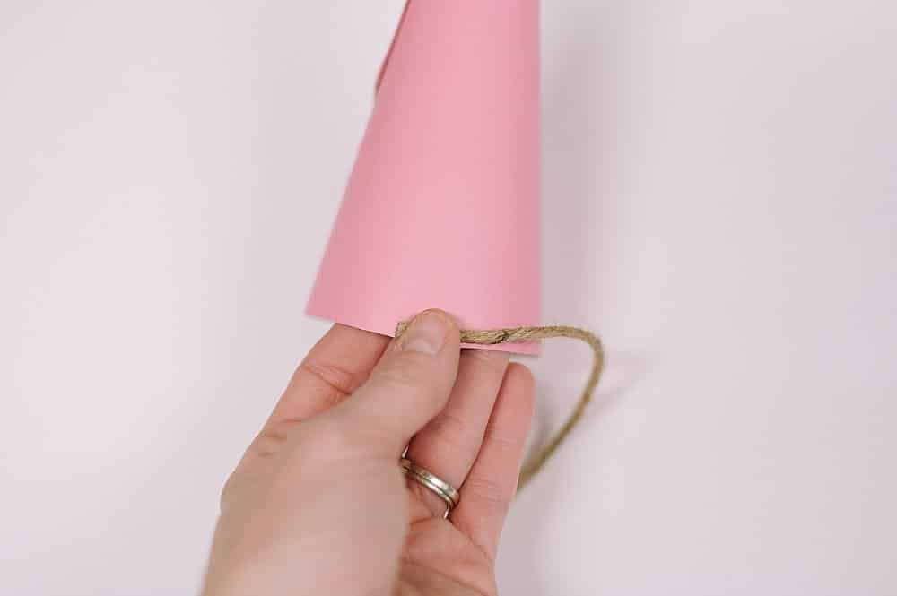 Hot glue twine and wrap around cone.