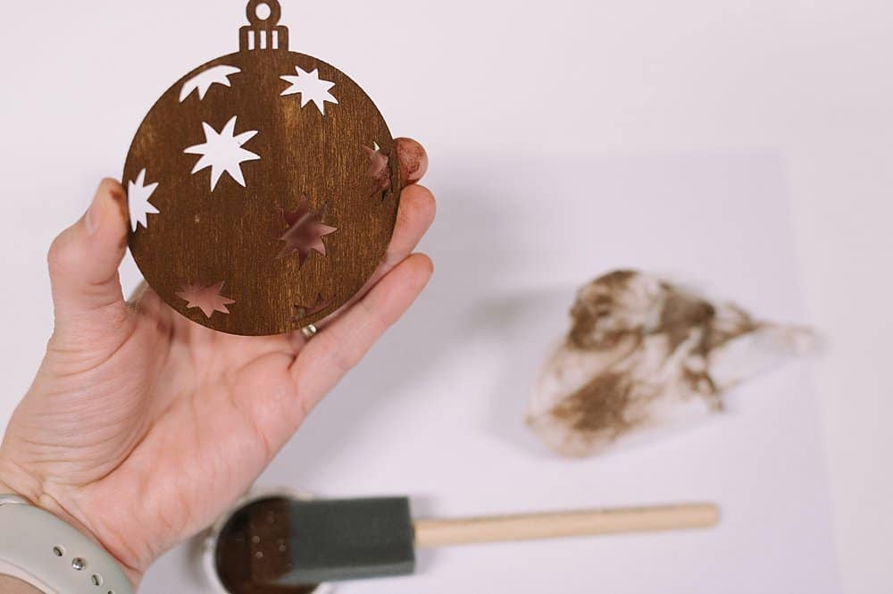wipe off extra stain from wooden ornaments
