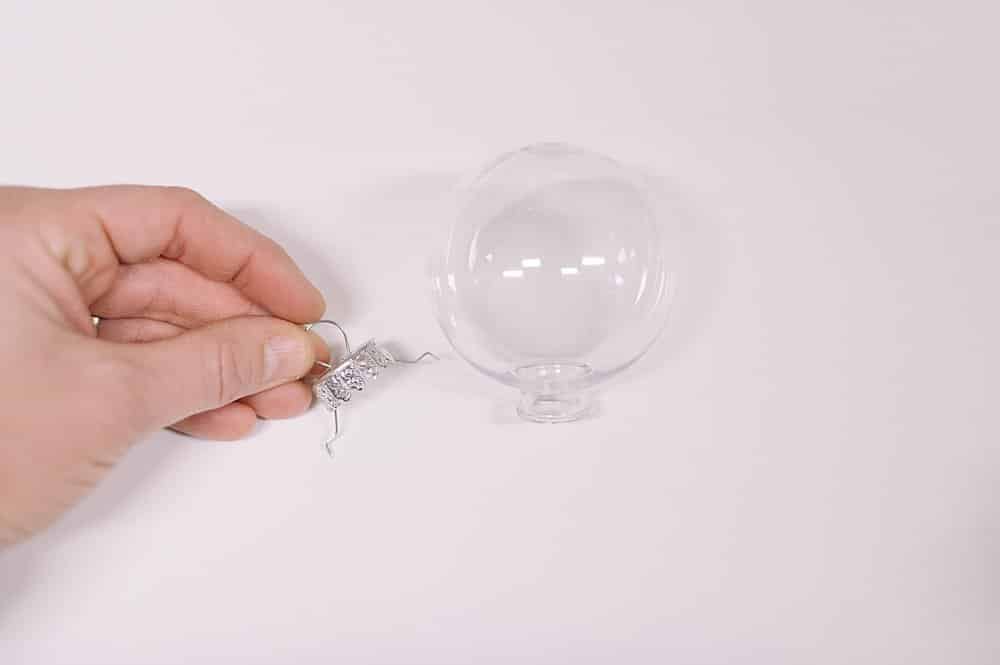 take the metal top off the plastic ball ornament