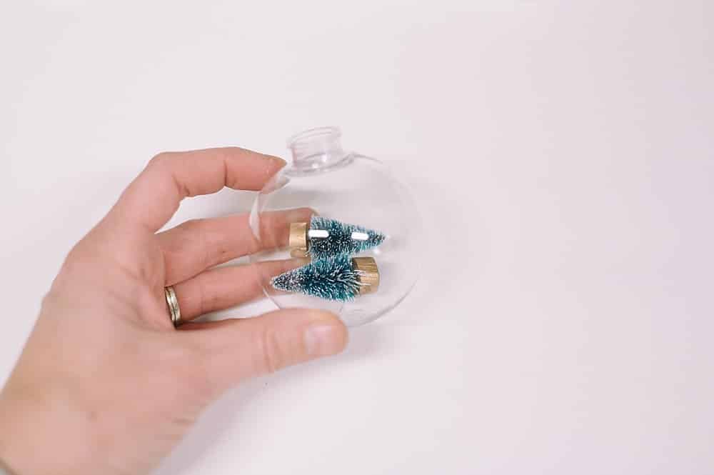 mini trees inside clear ornament