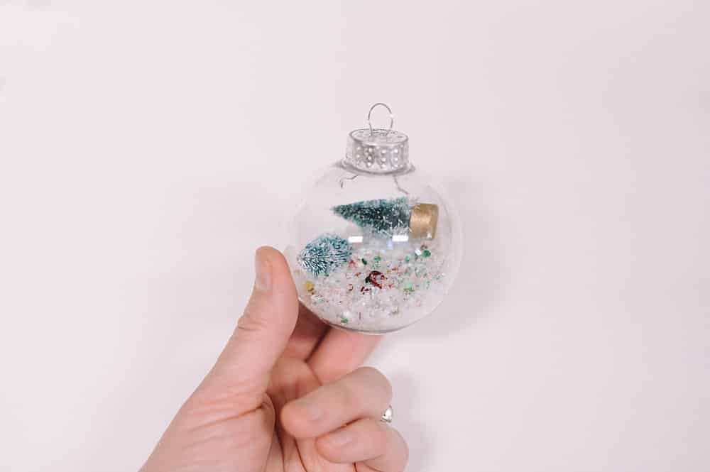 plastic bulb ornament with trees inside