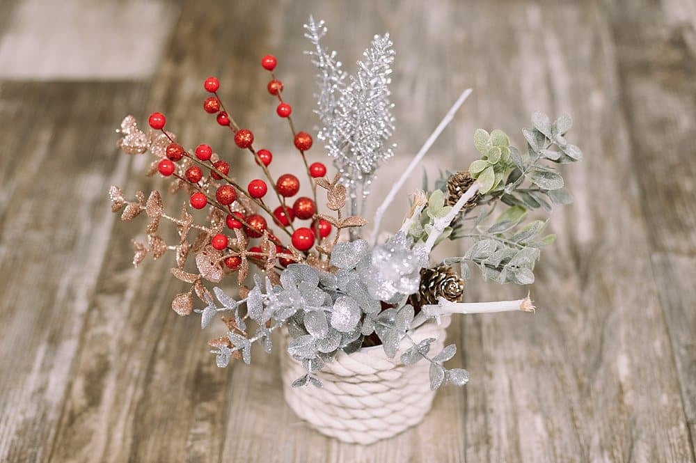 artificial plants and other holiday arrangements make pretty embellishments for Christmas gift wrapping