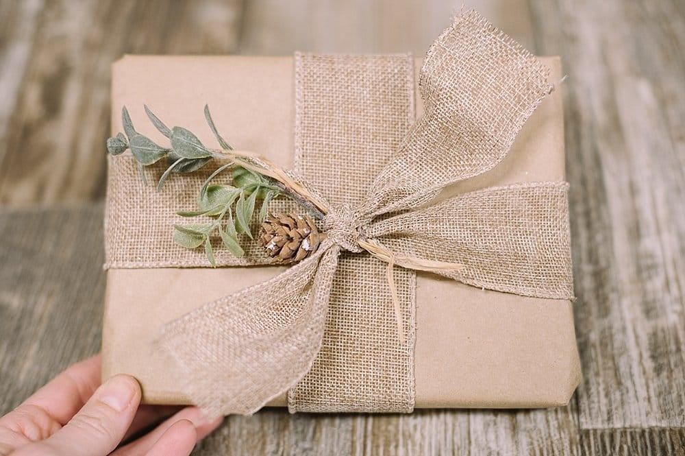 add faux winter foliage to gift wrap