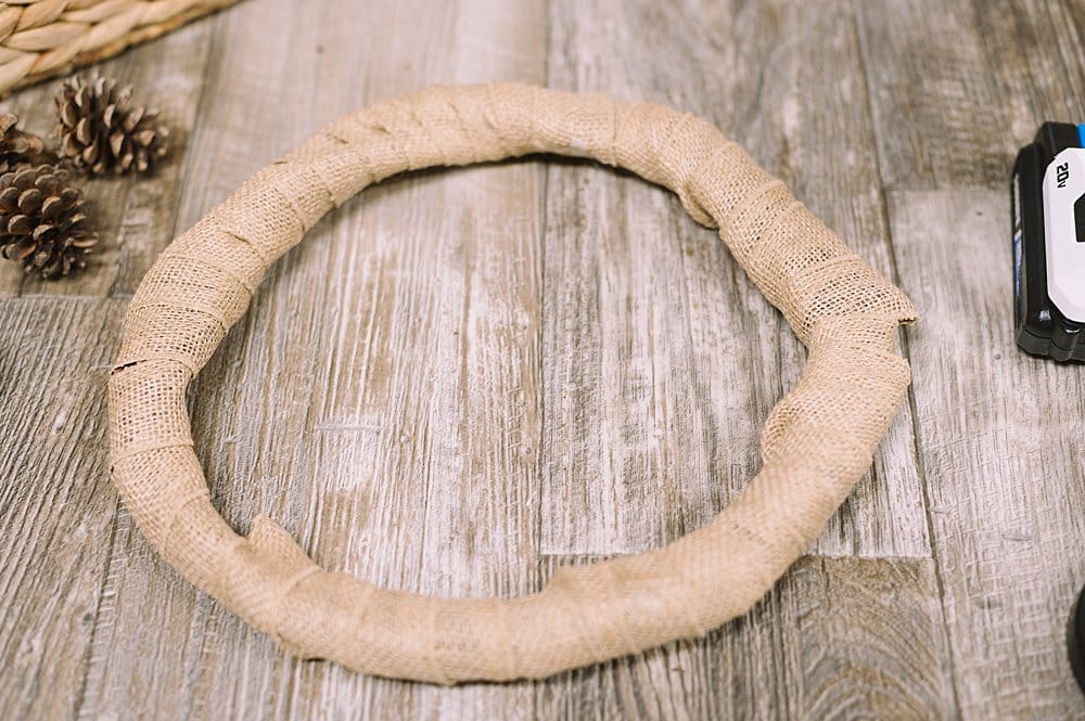 wrap burlap ribbon around a grapevine wreath form