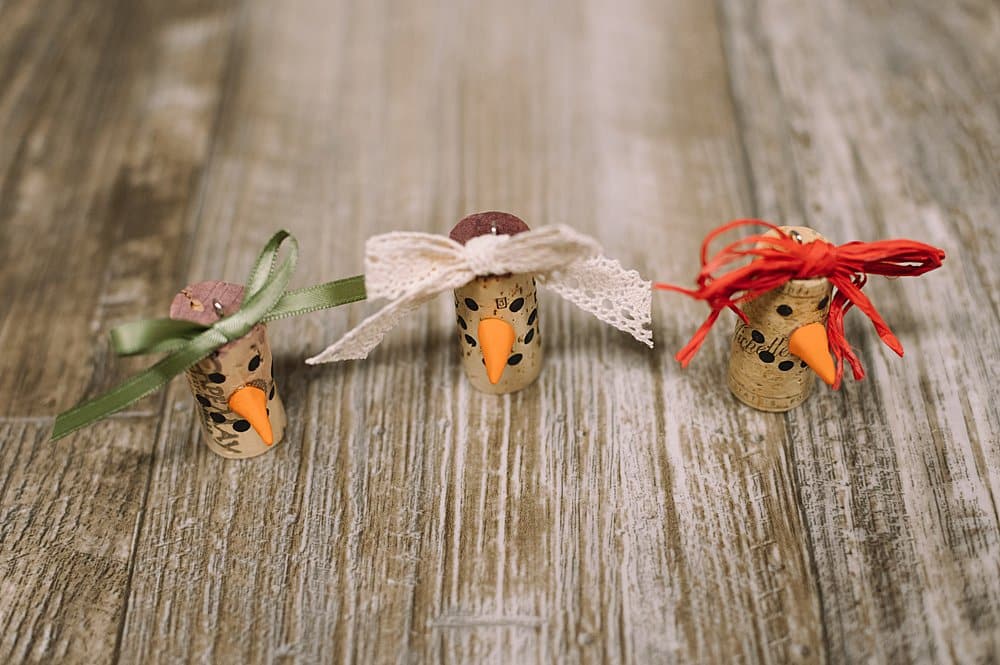 hot glue ribbon bow to top of cork snowman