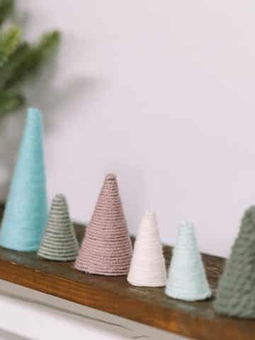 how to make mini christmas trees with paper cones and yarn