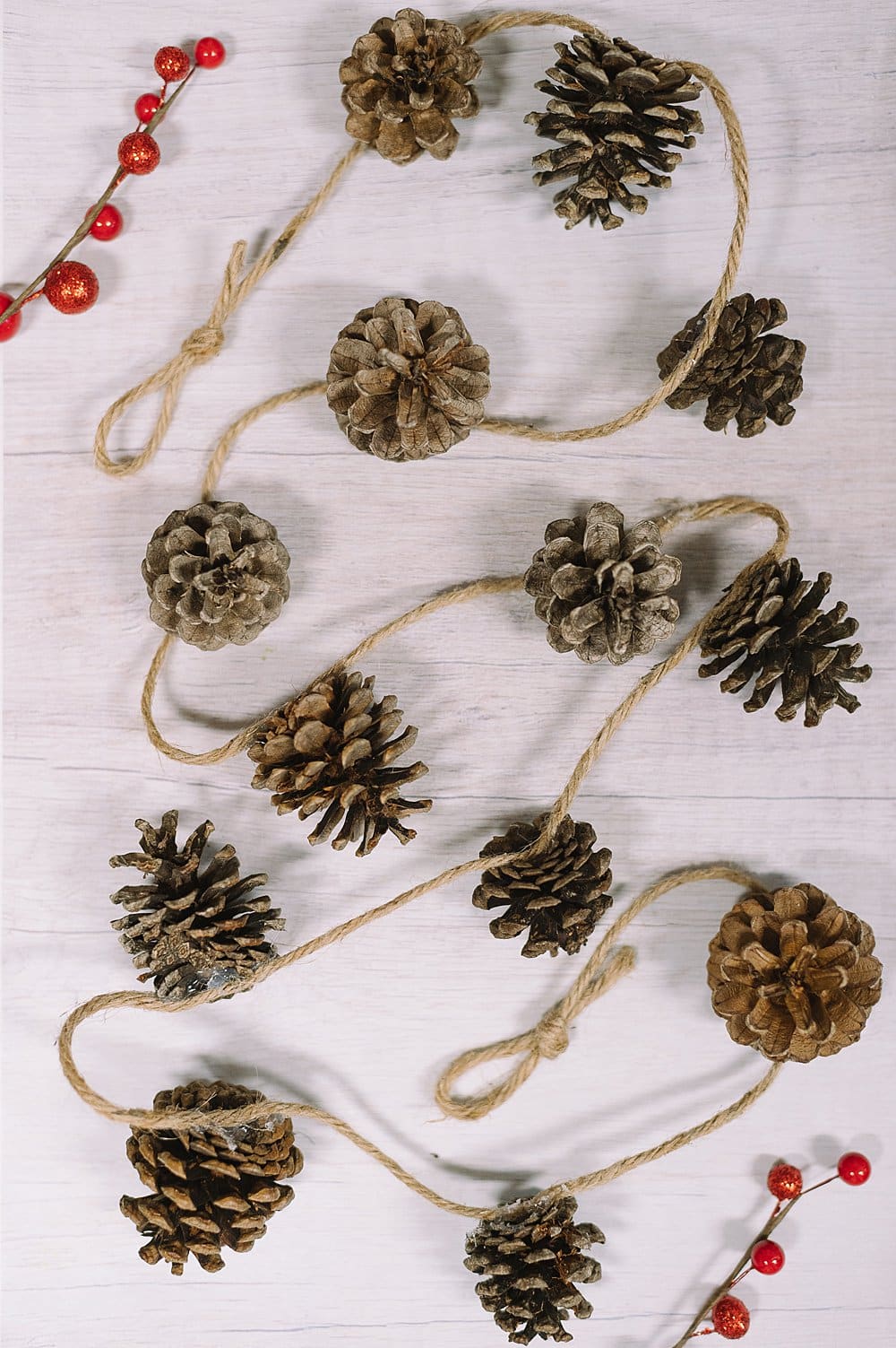 Pine cone garland with twine.