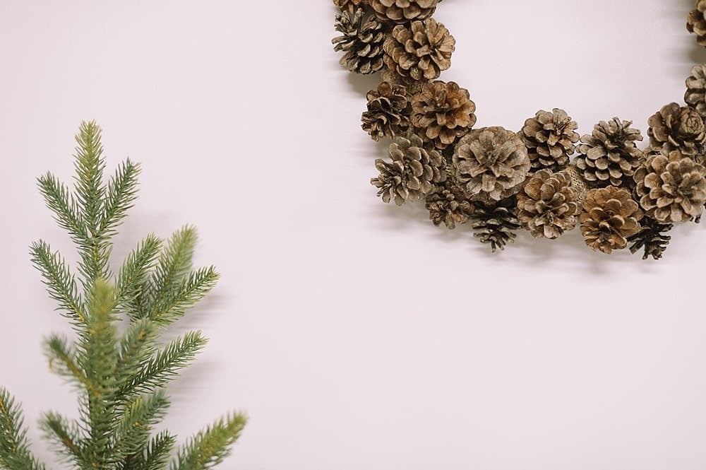 A closeup look at a pinecone wreath.