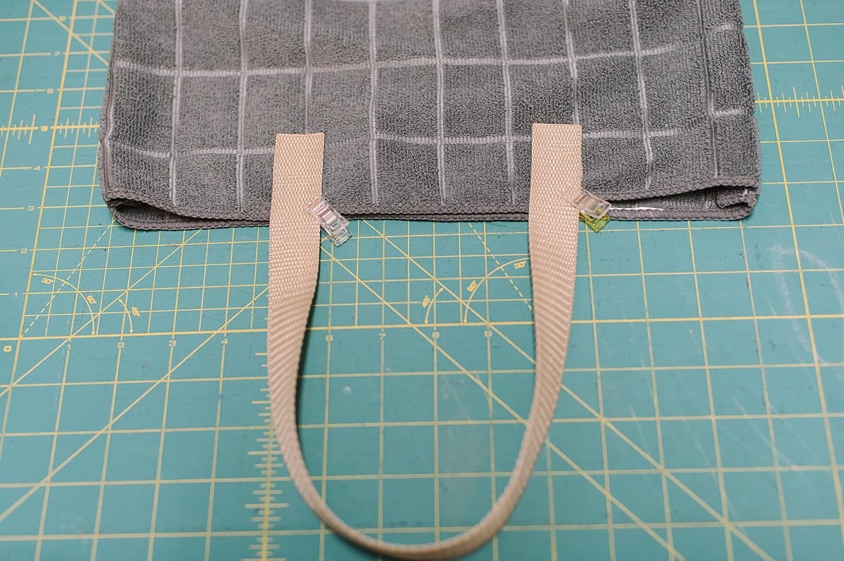 clip the straps to the outside or inside of the tote bag sides