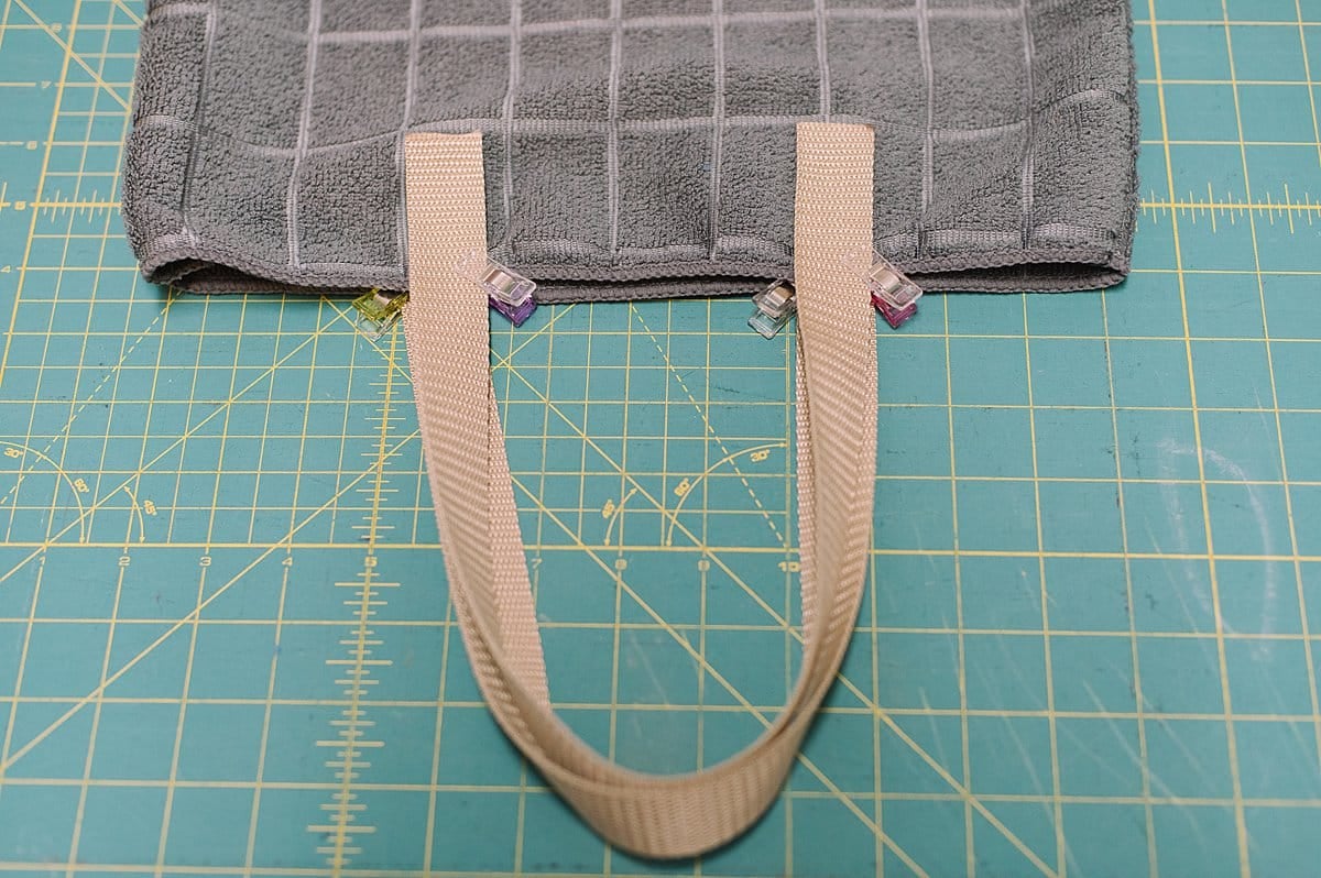 clip the straps to the outside or inside of the tote bag sides