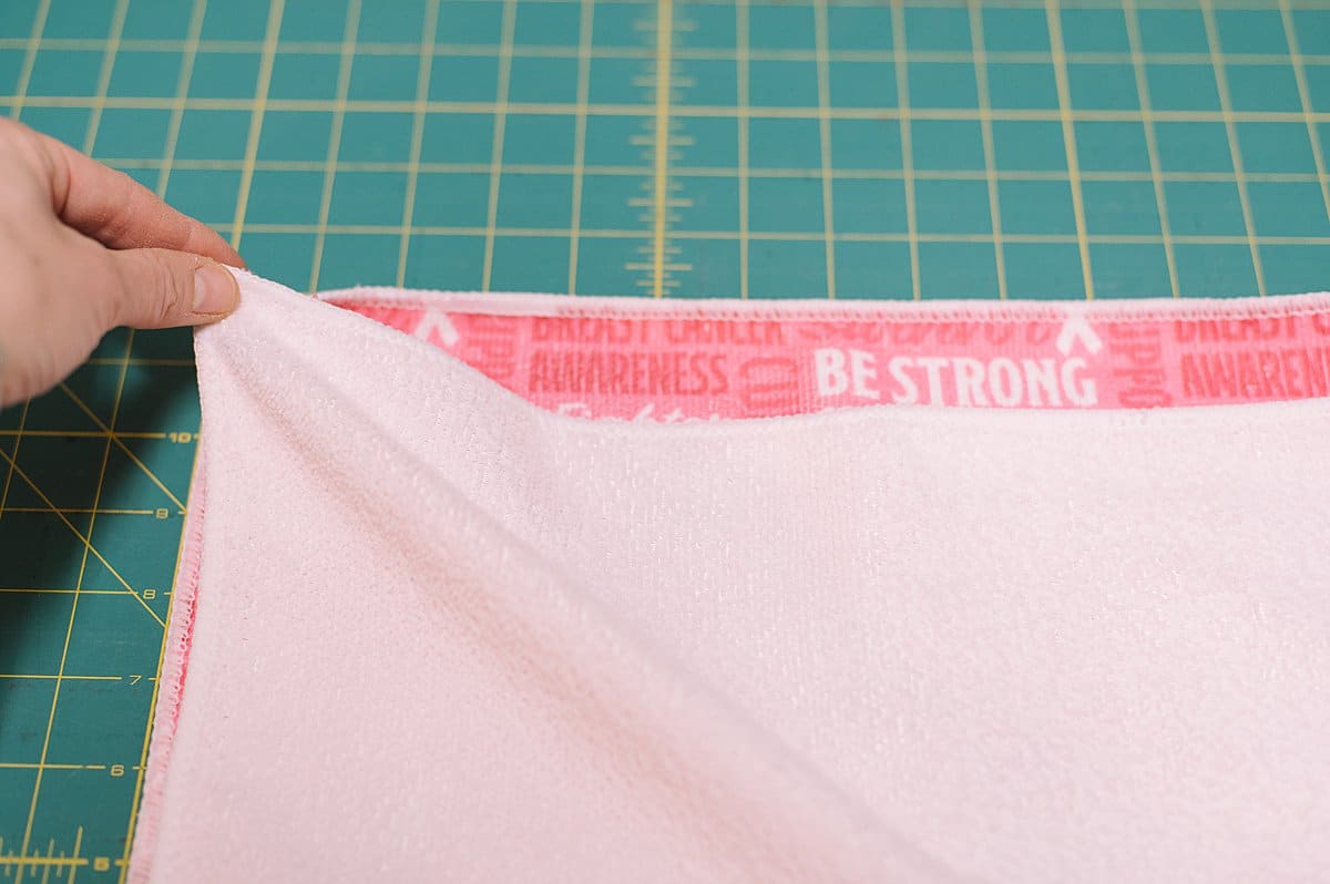 breast cancer hand towel turning into a DIY tote bag