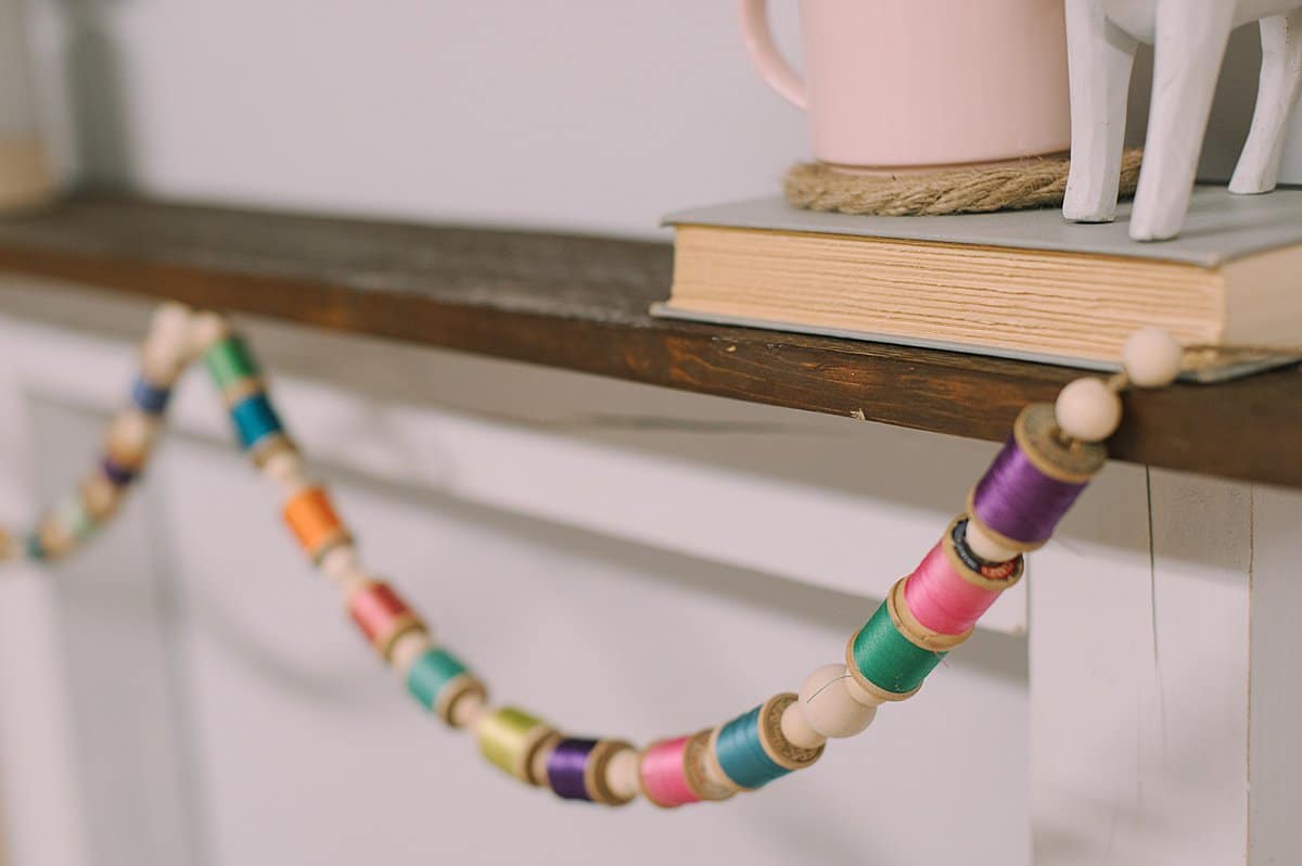 How to make a DIY Colorful Garland for your Mantel with Vintage Wooden Spools of Thread and Wood Beads