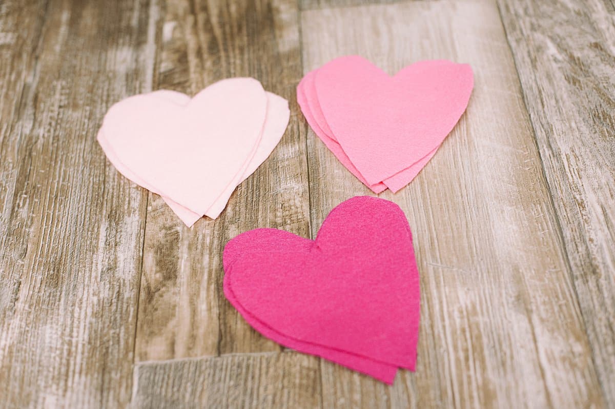 Cut out three hearts from each color of felt.