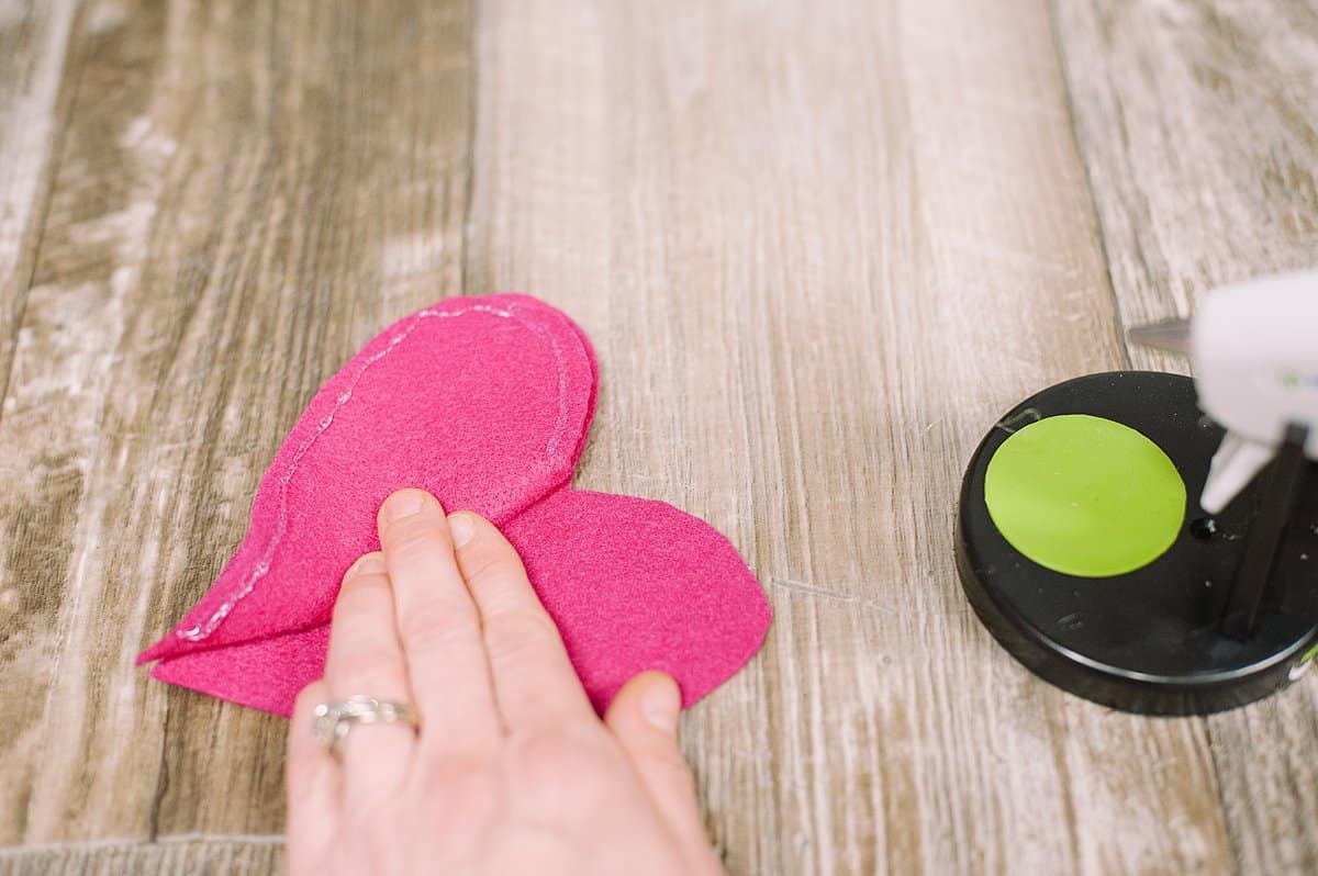 Hot glue three layers of felt together to make valentine's day hearts.