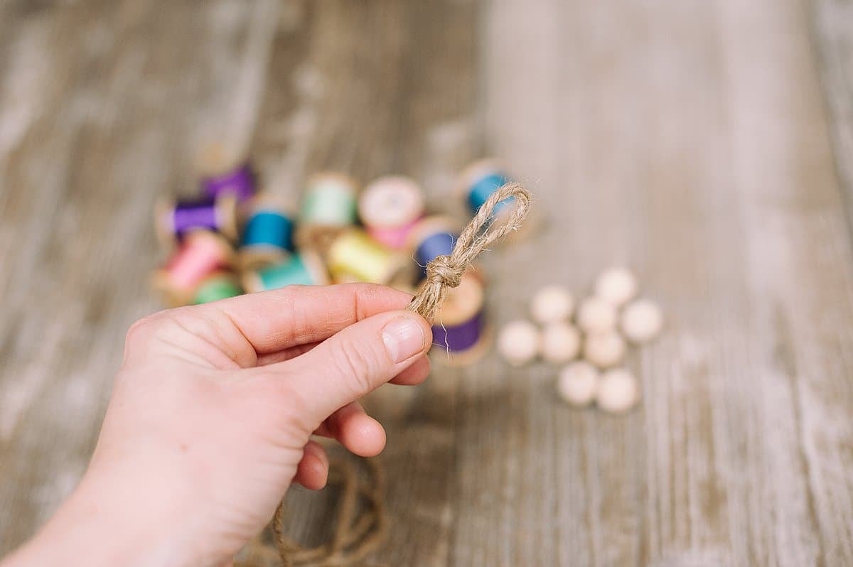 make a loop at one end of the twine string for your garland