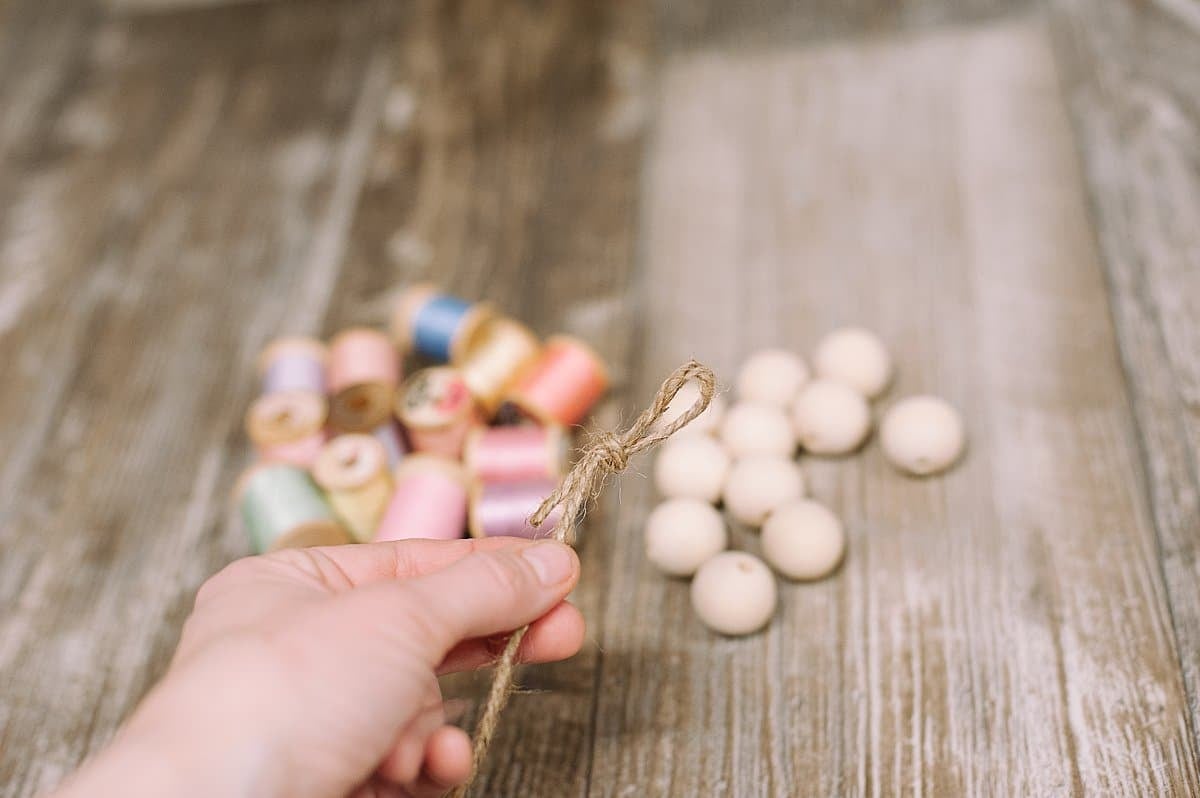 tie a knot at the end of the twine for your spring garland