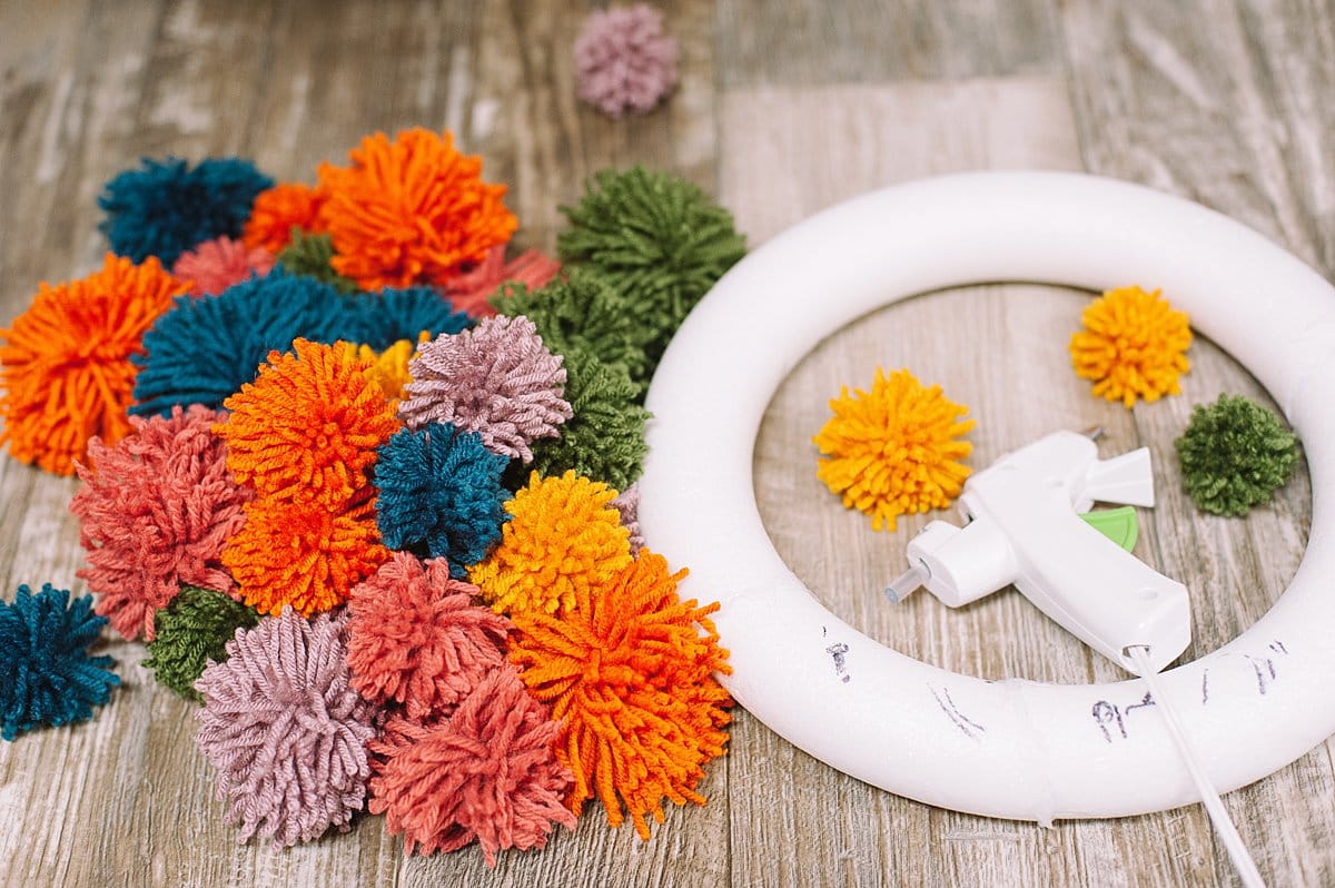 how to make a rainbow pompom wreath