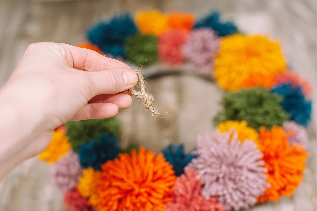 add hanging string to back of wreath