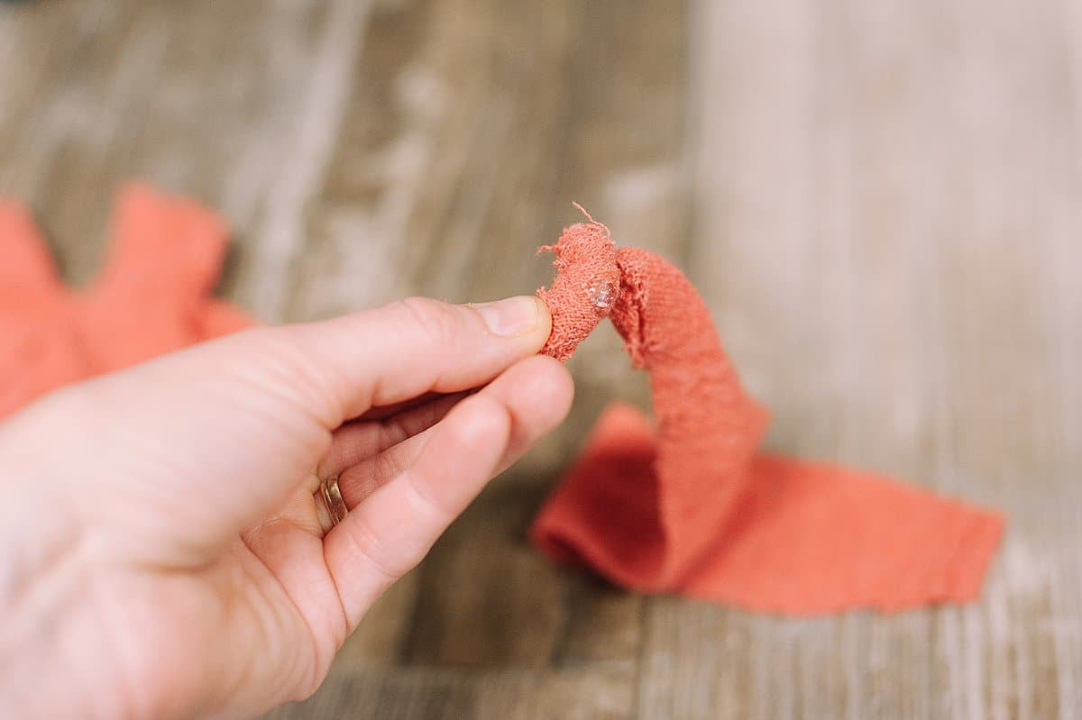 twist and hot glue the fabric to start the fabric rosette