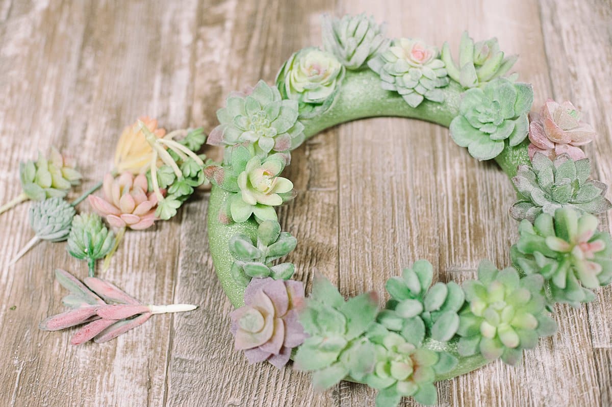 continue adding faux succulents to the wreath