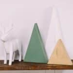 Learn how to make DIY wood trees for Christmas with wood boards and spray paint. These wooden Christmas trees are a simple, rustic, humble holiday decor idea, perfect for your mantel.