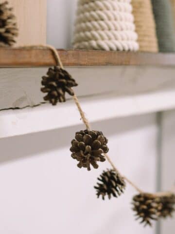 How to make a pinecone garland using clean pinecones and twine. It's the perfect garland for fall!