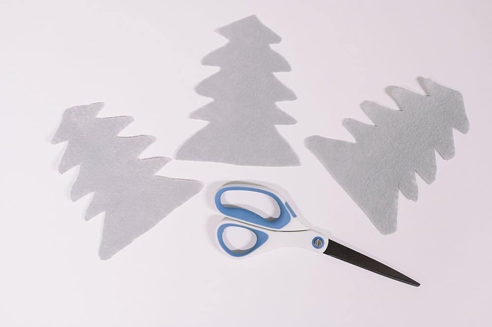 cut out three felt christmas tree shapes