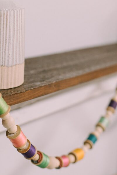 DIY Colorful Garland with Spools of Thread and Wooden Beads