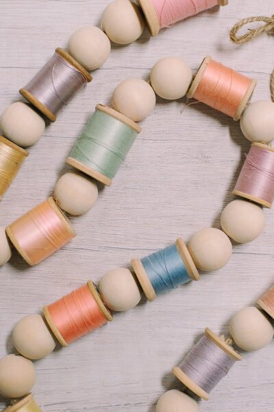How to Make an Easter Garland with Spools of Thread and Wood Beads