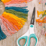 How to Make a Wreath out of Rainbow Yarn | How to Make a Rainbow Yarn Wreath