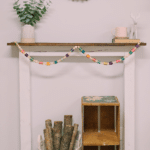 How to Make a DIY Colorful Garland using Wood Beads and Vintage Wooden Thread Spools