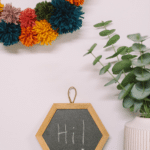 How to Make a DIY Rainbow Pompom Wreath with Rainbow Yarn