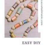 How to make a spring garland with wooden beads and pastel thread spools.
