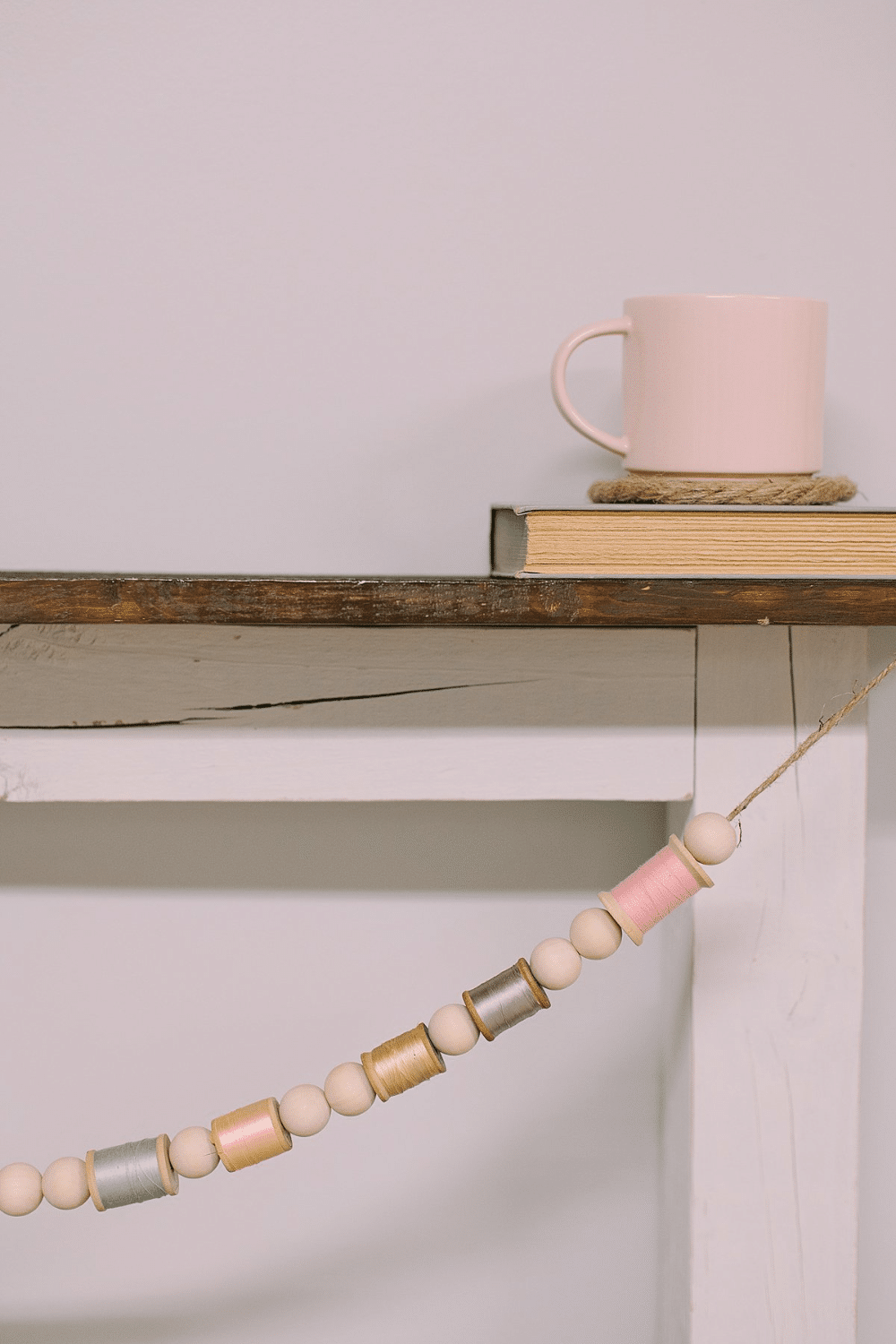 How to Make a Garland for Spring with Wood Beads and Spools of Thread