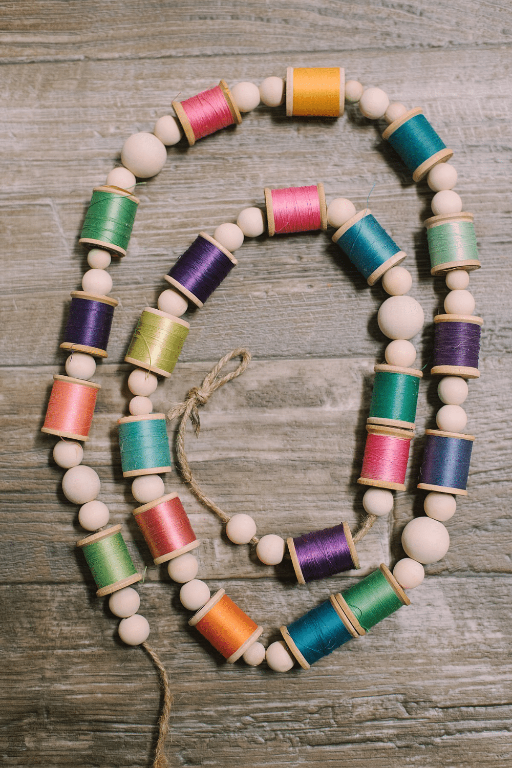 DIY Colorful Garland with Spools of Thread and Wooden Beads