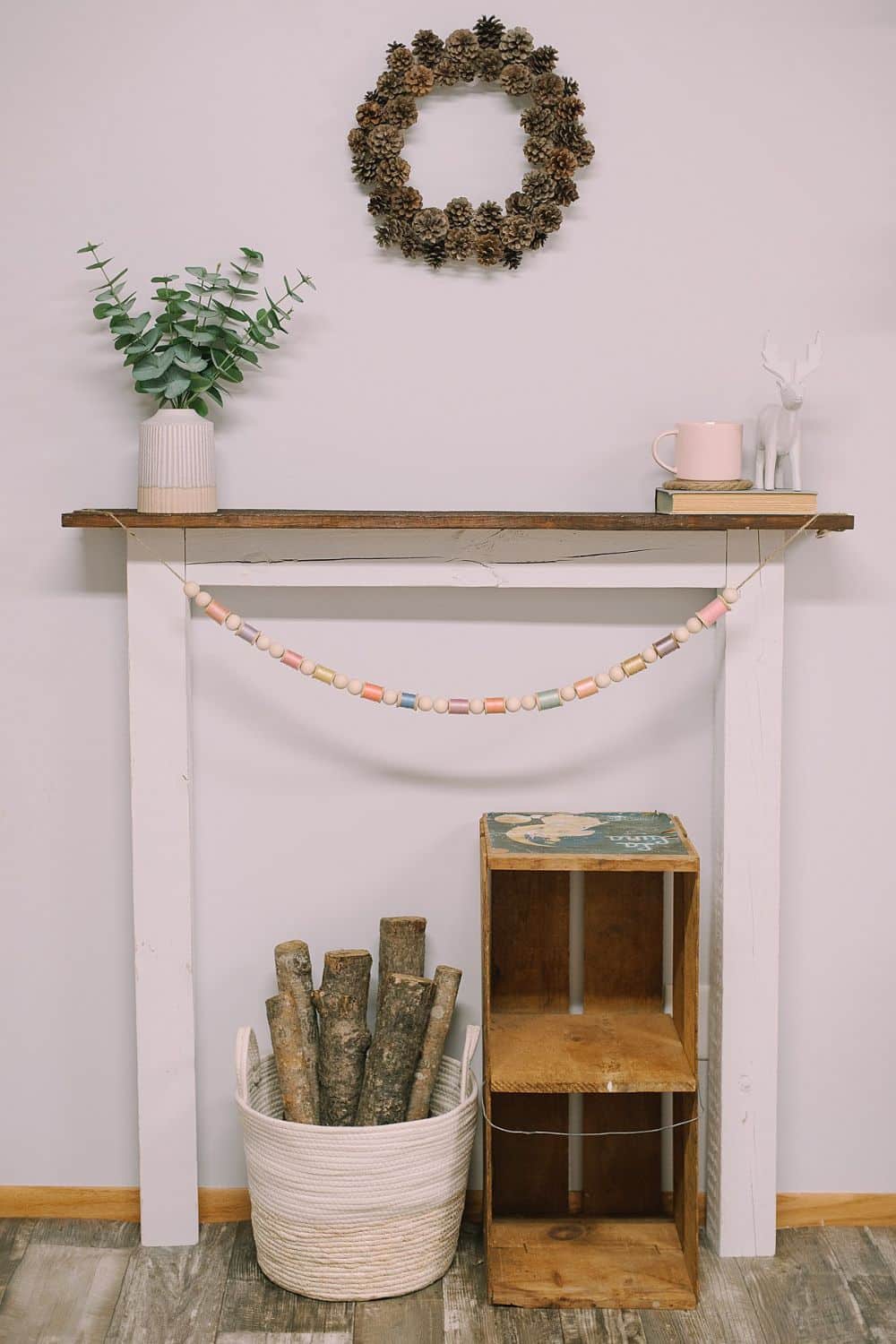How to Make a Garland for Spring with Wood Beads and Spools - Laura ...