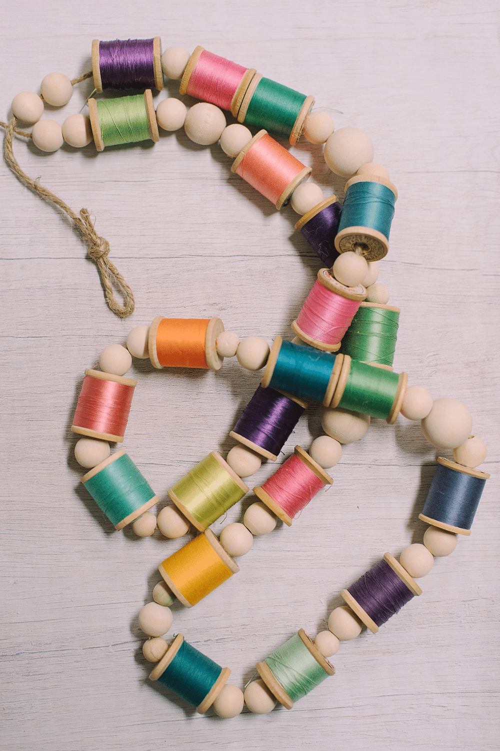 DIY Colorful Garland with Spools of Thread and Wooden Beads