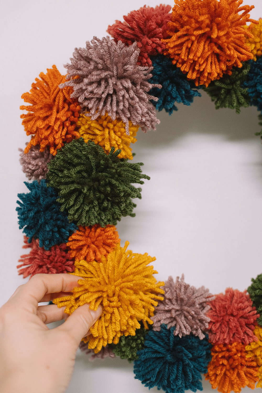 How to Make a Rainbow Pompom Wreath