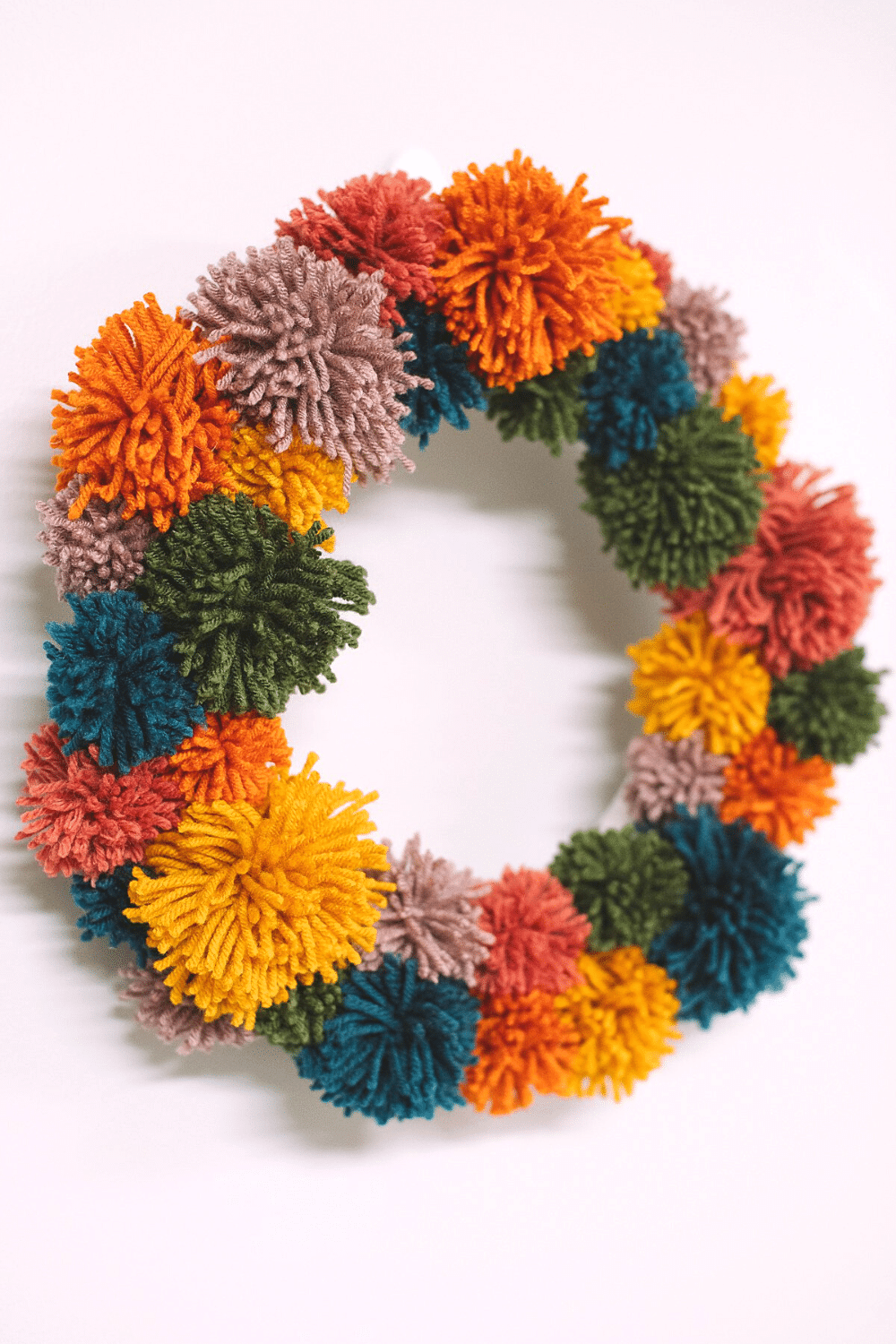 How to Make a Rainbow Pompom Wreath