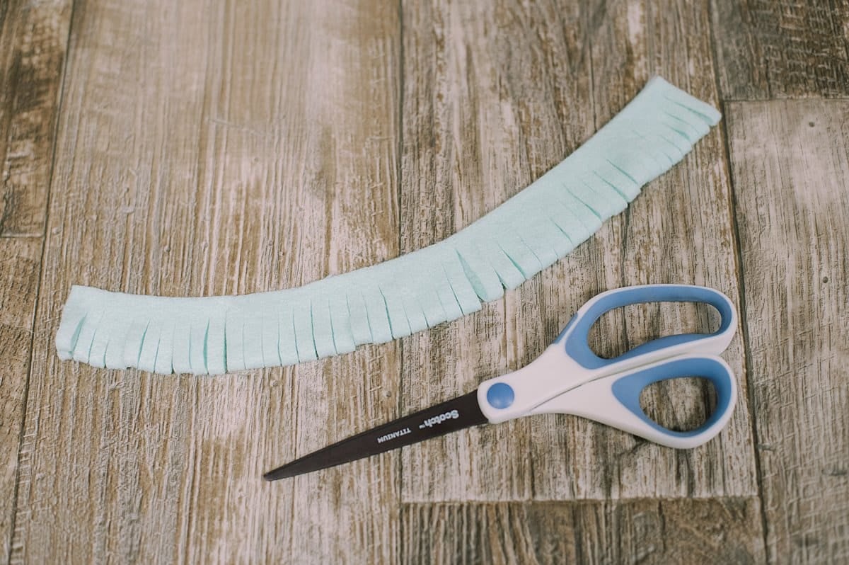 A felt mum made by cutting thinner fringe sections.