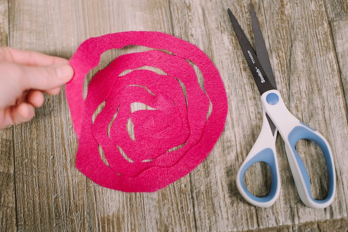 A circle of felt cut into a wave spiral shape.