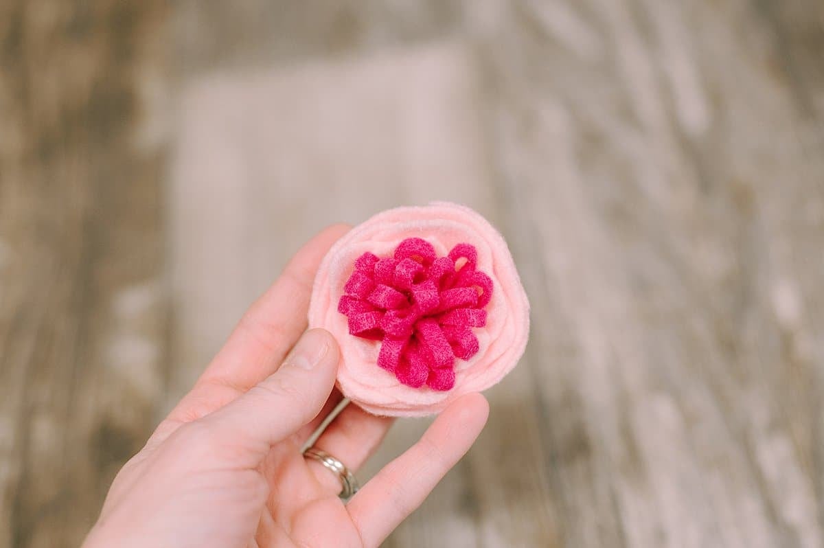 A felt rose with a fringe center.