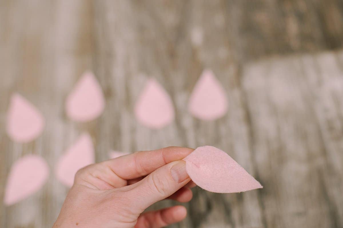 Felt petals pinched and glued on the end.