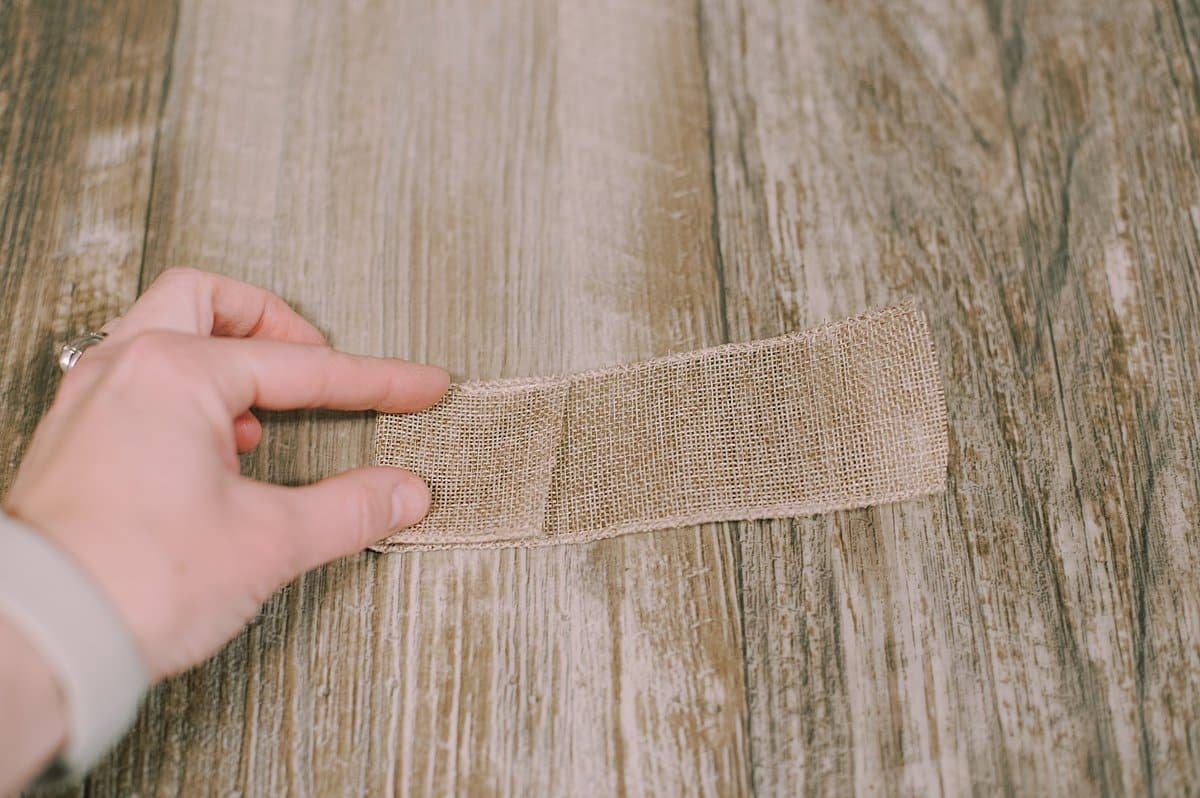 fold edges of wired burlap ribbon