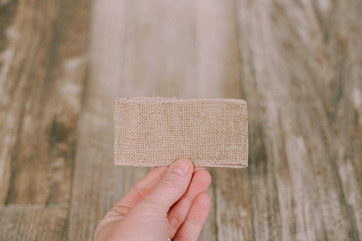 folded burlap ribbon to make a bow