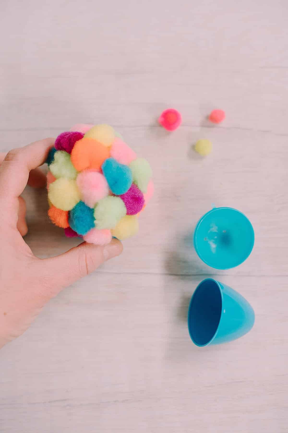 pom pom covered plastic easter egg